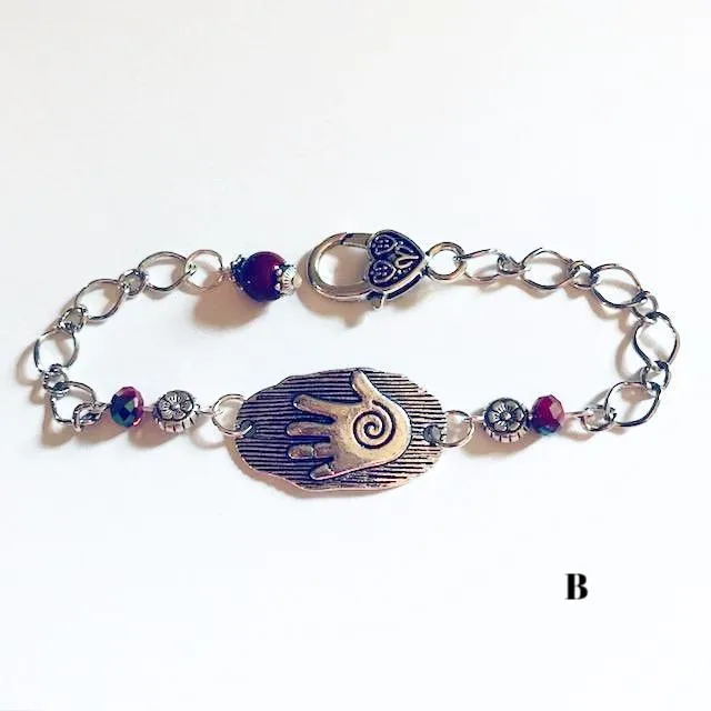 chain bracelets with  swirl centered hand