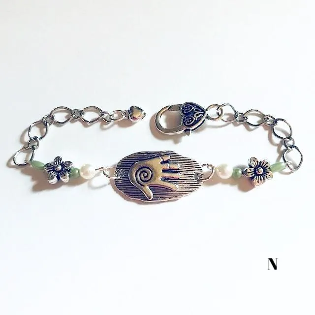 chain bracelets with  swirl centered hand
