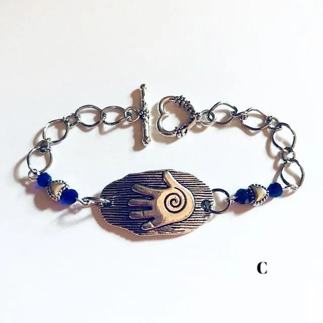 chain bracelets with  swirl centered hand