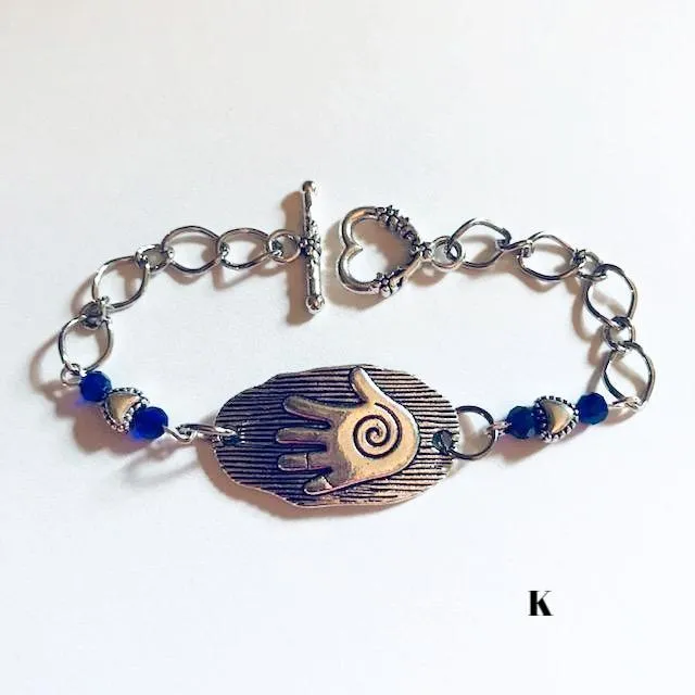 chain bracelets with  swirl centered hand
