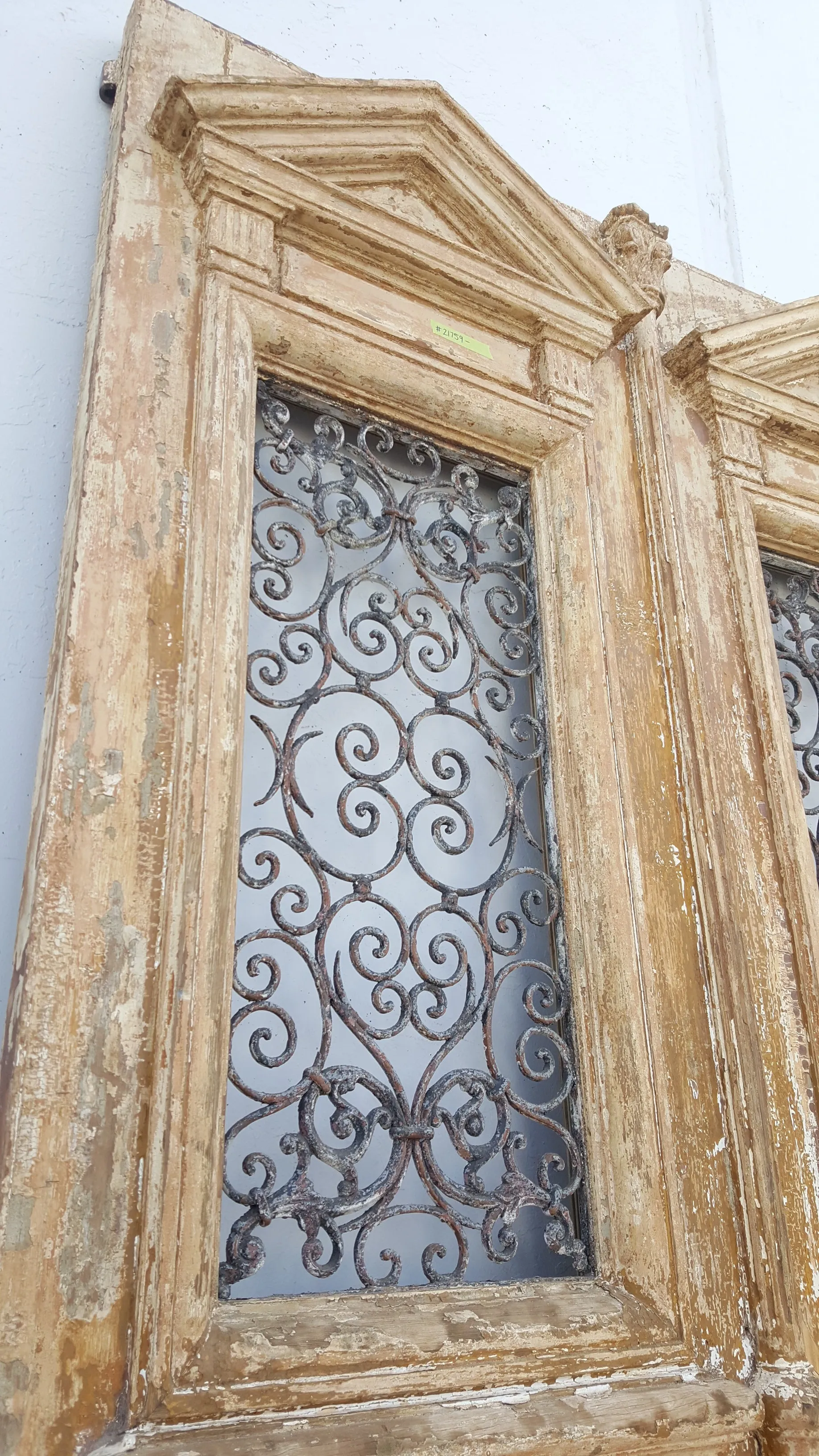 Pair of Antique Ornate Wood Carved Doors with Iron Scrollwork Inserts (no glass)