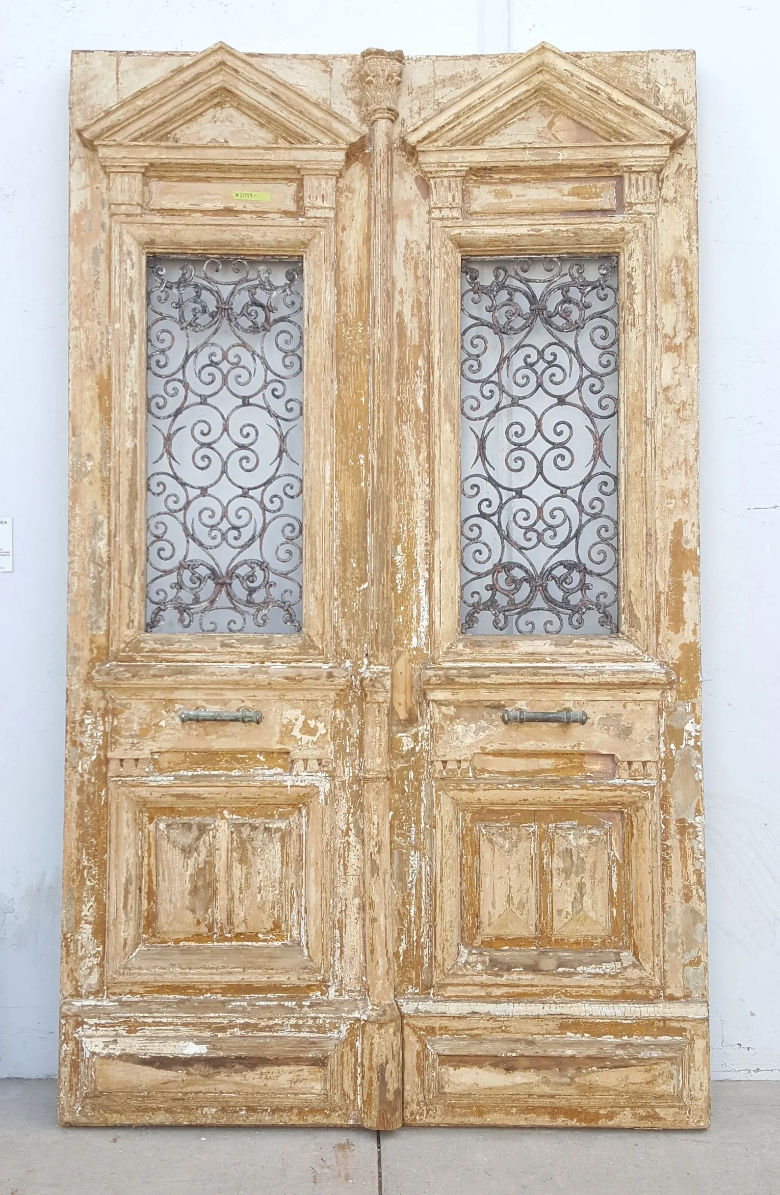 Pair of Antique Ornate Wood Carved Doors with Iron Scrollwork Inserts (no glass)